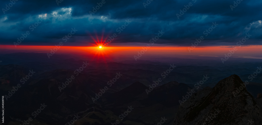 High resolution stitched panorama sunset with a sun star at the famous Saentis summit, Schwaegalp, Appenzell, Alpstein, Switzerland High resolution stitched panorama sunset with a sun star at the famous Saentis summit, Schwaegalp, Appenzell, Alpstein, Switzerland