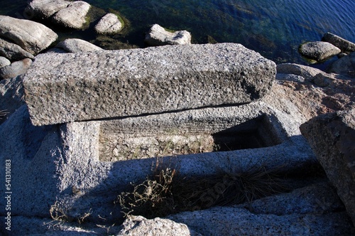 Landscape around Lake Bafa in Turkey, with ancient tombs near the water. photo