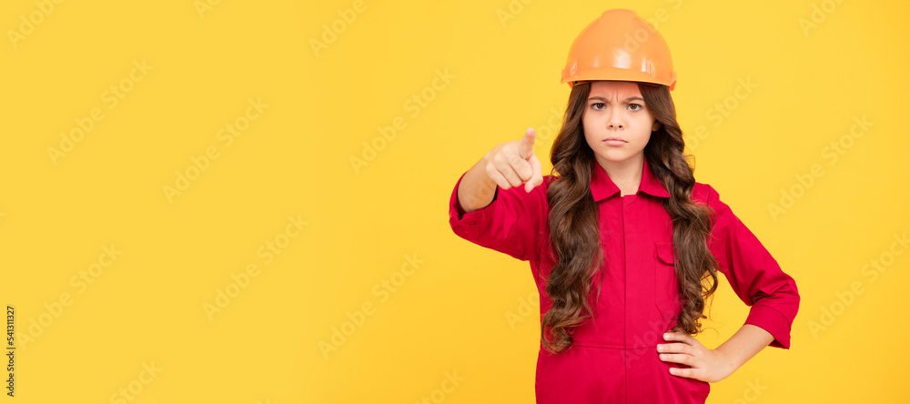 teen girl pointing finger. child in protective helmet for building. protection and safety. Child builder in helmet horizontal poster design. Banner header, copy space. teen girl pointing finger. child in protective helmet for building. protection and safety. Child builder in helmet horizontal poster design. Banner header, copy space.
