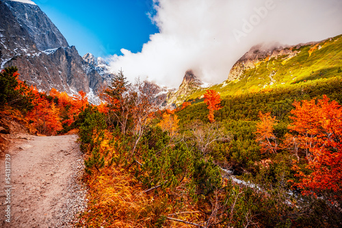 Hiking in national park High Tatras. HiIking from white lake to Green lake in the mountain landscape, Zelene pleso, Slovakia. photo