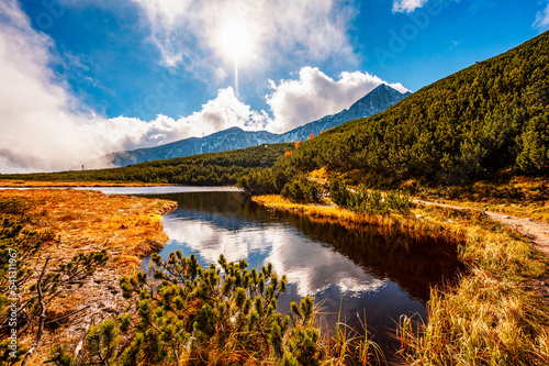 Hiking in national park High Tatras. HiIking to biele pleso near zelene pleso in the mountain Vysoke Tatry, Slovakia photo