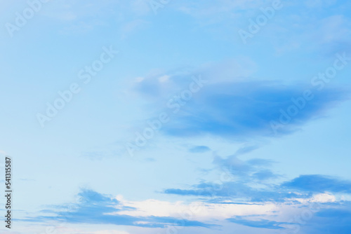 Blue clouds in sky during morning background. Clear skies with blue clouds at sunset above field. Open view out windows summer day.