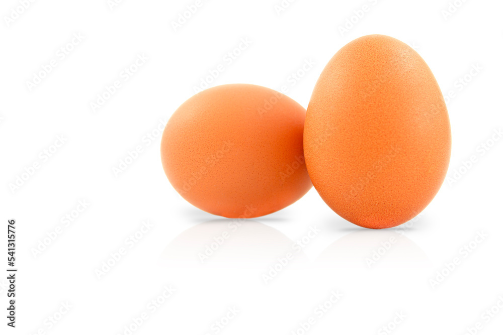 Two fresh eggs isolated on a white background. Two fresh eggs isolated on a white background.