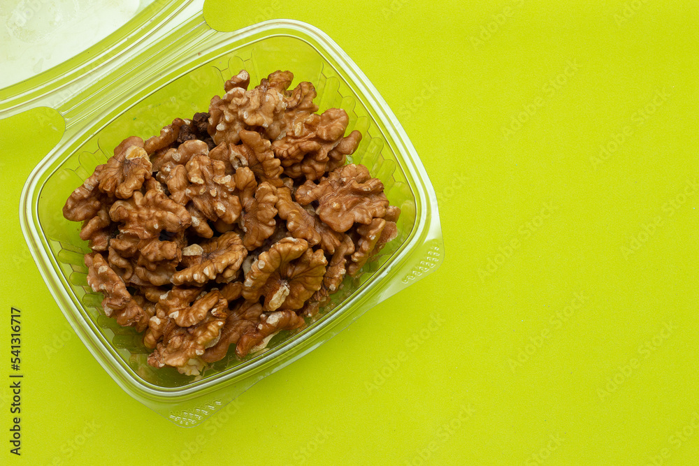 bowl full of almonds on a colored background bowl full of almonds on a colored background
