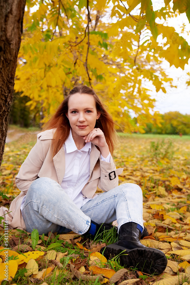Portrait of beautiful young girl in autumn park Portrait of beautiful young girl in autumn park