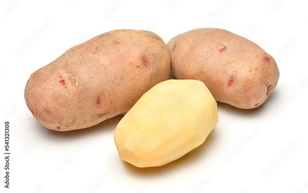 potatoes close-up, raw and peeled, objects are isolated on a white background potatoes close-up, raw and peeled, objects are isolated on a white background