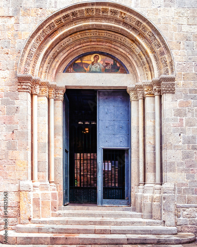 Medieval door in the Barcelona cathedral located in the Gothic district in Barcelona, Spain