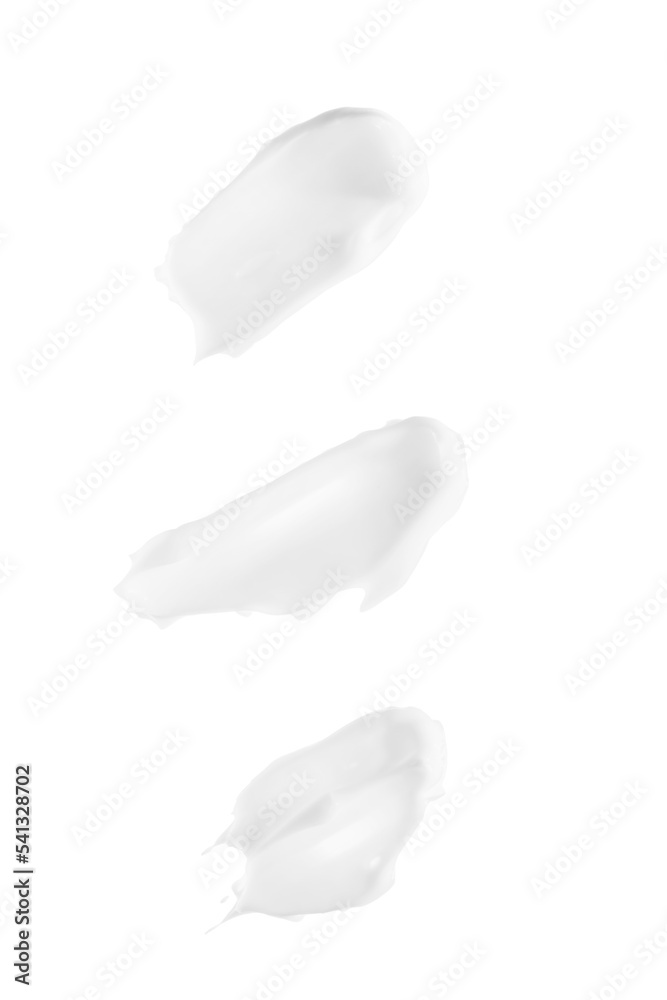 Smears of white cream isolated on white background Smears of white cream isolated on white background