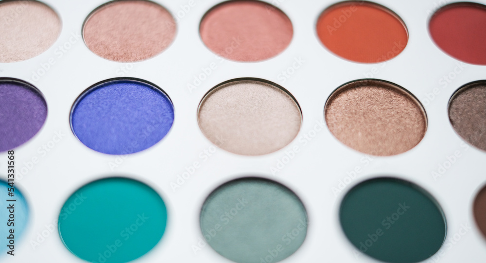Selective focus of eyeshadow palette with various colors in pearly and matte closeup Selective focus of eyeshadow palette with various colors in pearly and matte closeup