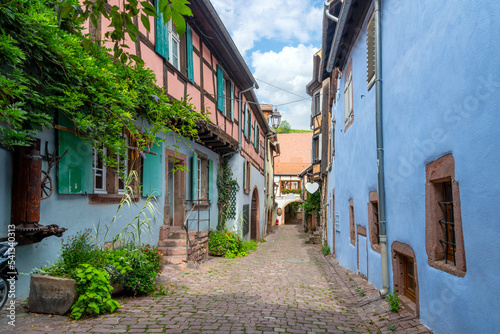 A colorful alley of medieval half timber homes in the French village of Ribeauville  France  one of the stops on the wine route in the Alsace region.