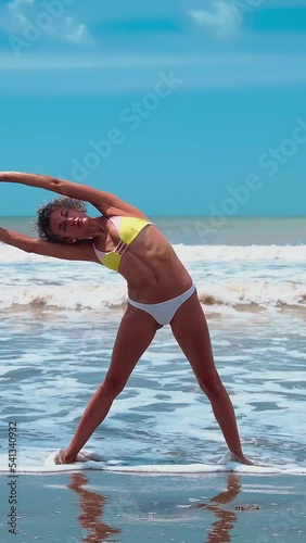 yoga girl on the beach by the sea one summer day	