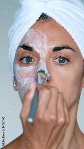 woman applying a skin care mask	