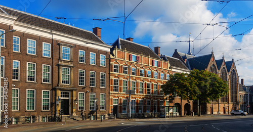 View of Kneuterdijk and Lange Voorhout streets in Old Town The Hague with building of State Council and medieval Protestant Kloosterkerk church on summer day, Netherlands