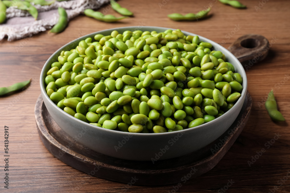 Bowl of delicious edamame beans on wooden table Bowl of delicious edamame beans on wooden table