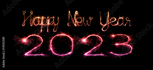 2023 happy new year fireworks celebration written sparkling at night.