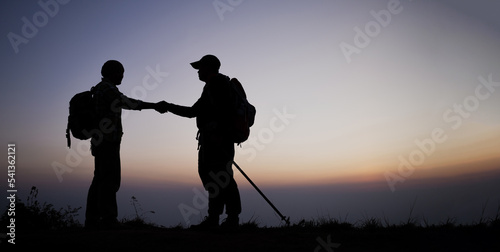 Silhouette of Teamwork helping hand trust help