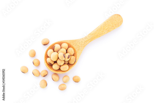 Soybean seeds in wooden spoon isolated on white background , top view.
