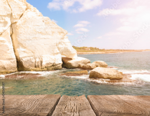 Empty wooden table at sea r...