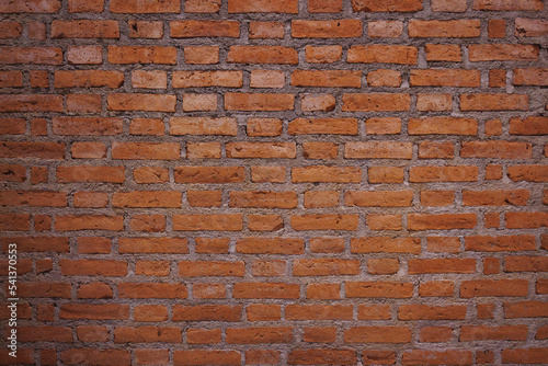 Old red brick wall pattern background. Vintage look of brick surface texture from brickwork. It can be use as wallpaper.