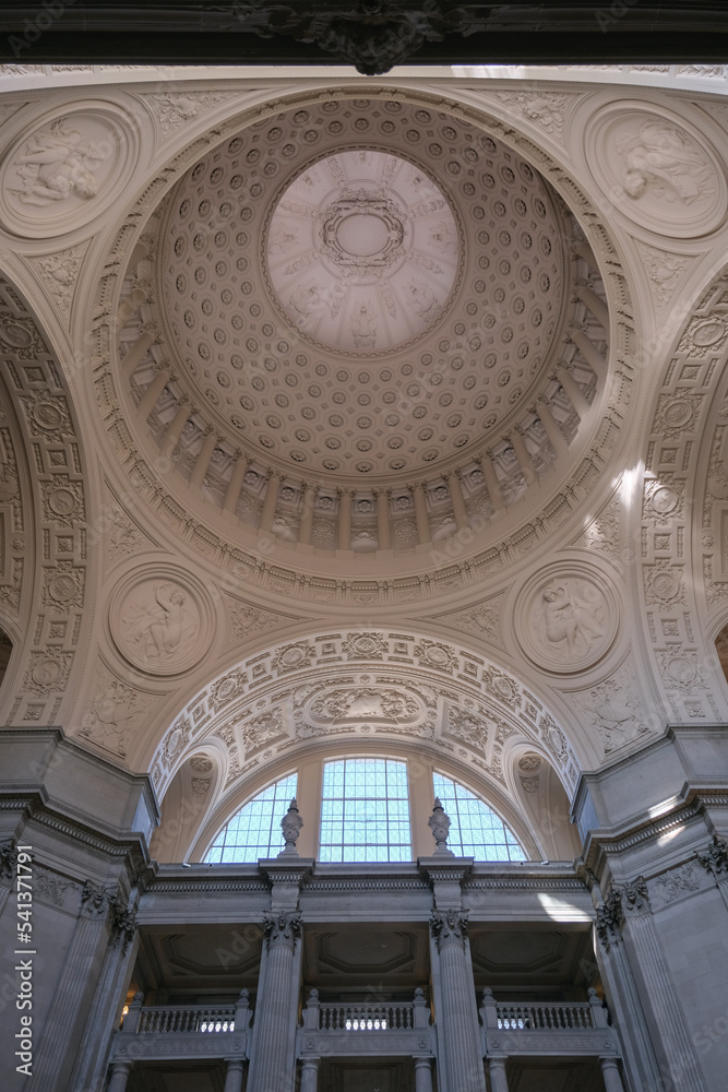Breathtaking architecture details of panoramic dome columns scenic building interior view with historic walls, chandeliers, brass railings, marble statues in public city hall landmark
