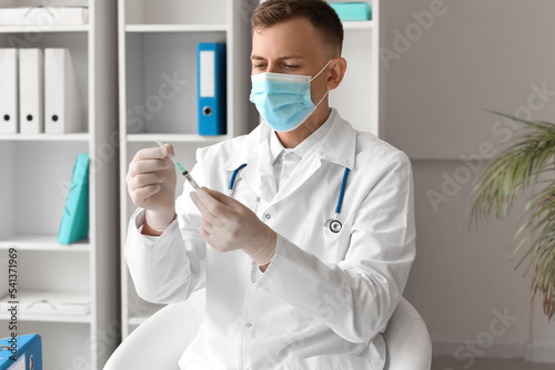 Male doctor in medical mask...