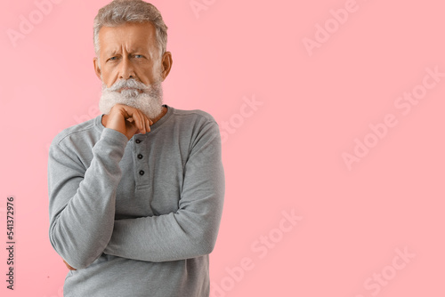 Thoughtful mature man on pi...