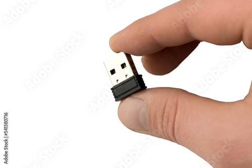 small flash drive in hand close-up. Isolate, transparent background