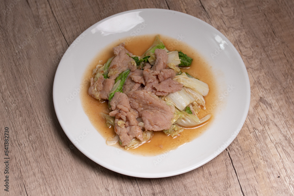 Stir Fried Cabbage with Pork in a White Plate