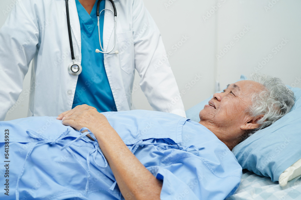 Doctor taking care, help and encourage Asian elder senior woman patient in clinic hospital. Doctor taking care, help and encourage Asian elder senior woman patient in clinic hospital.
