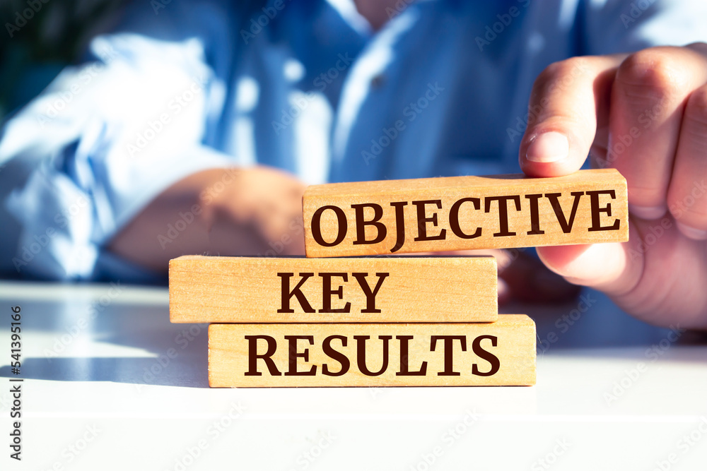 Wooden blocks with words 'Objective Key Results'. Business concept