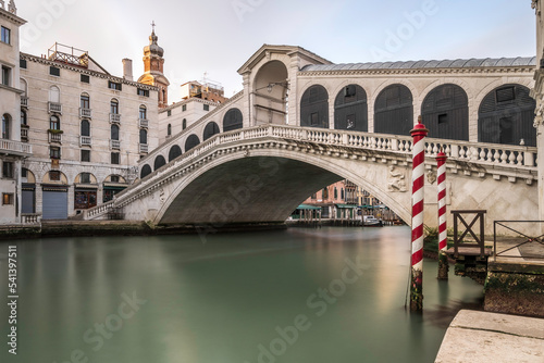 Panorama of Grand Canal and Rialto Bridge in the Morning, Venice, Italy. Long exposure to smooth the water of the canal