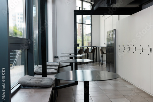 Canvastavla Hostel dining room interior with modern furniture and white lockers