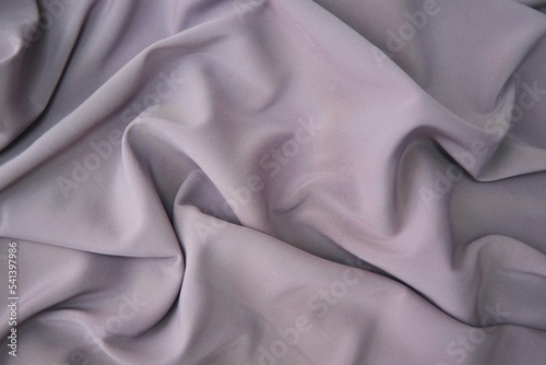 The texture of the fabric is pink. Textile industry for the creation of clothing.