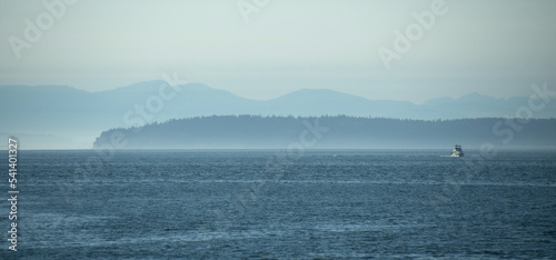 Boat and blue horizon line in Puget Sound