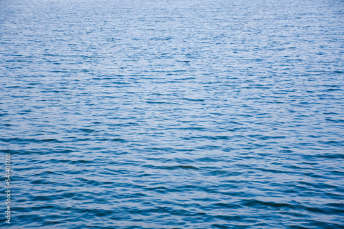 The surface of the water is blue in the evening.