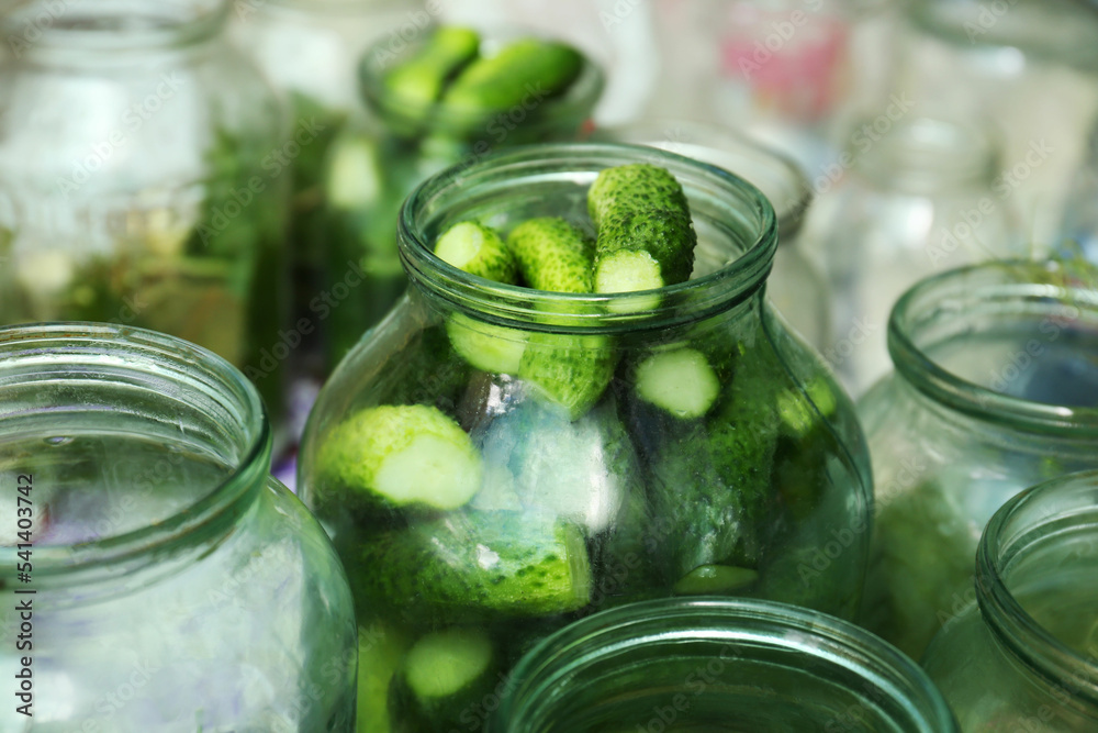 Glass jar with fresh cucumbers, closeup. Pickling vegetables Glass jar with fresh cucumbers, closeup. Pickling vegetables