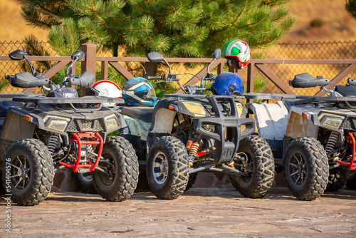ATVs in the parking lot are rented in the recreation area. Quad bike and equipment. Extreme Entertainment. Kazakhstan, Shymkent - October 17, 2022