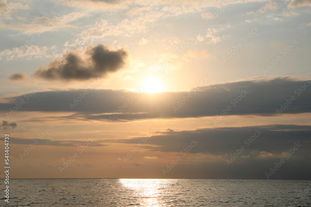 Picturesque view of sunset with beautiful clouds over sea