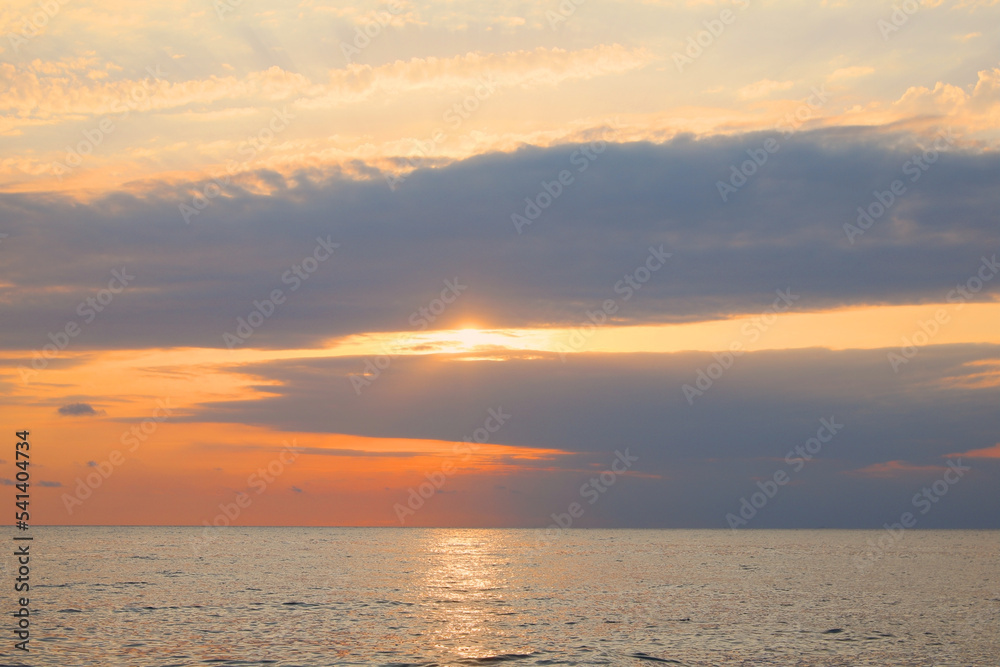 Fototapeta premium Picturesque view of sunset with beautiful clouds over sea