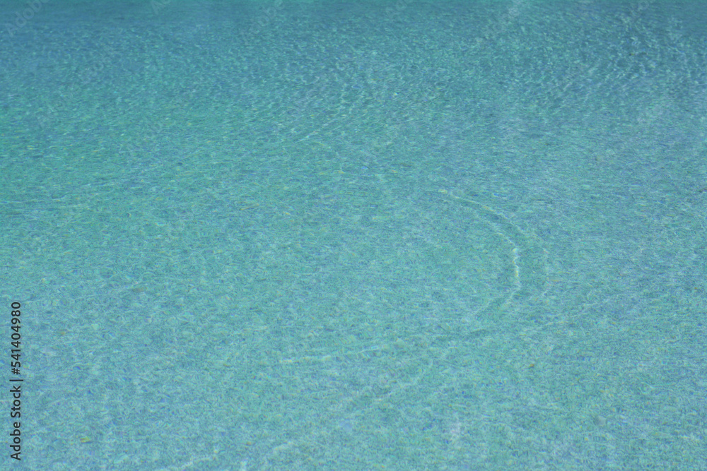 Calm clear water in swimming pool outdoors