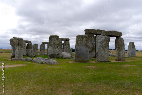 Famous UNESCO World Heritage Site Stonehenge on Salisbury Plain in Wiltshire on a cloudy summer day. Photo taken August 2nd, 2022, Stonehenge, England.