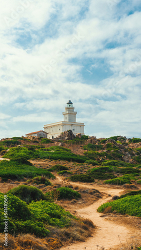 lighthouse on the coast of the sea © Alex Citeroni