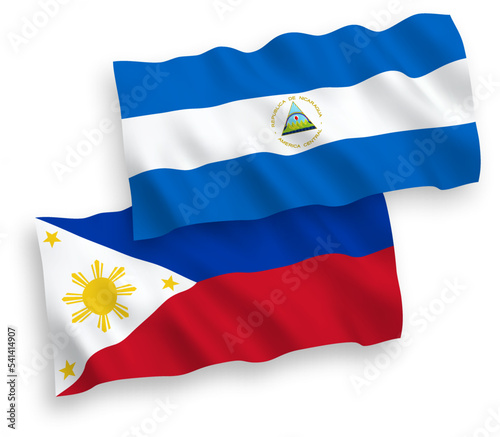 National vector fabric wave flags of Nicaragua and Philippines isolated on white background. 1 to 2 proportion.