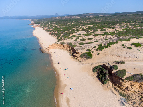 Top view with drone of the wild Scivu bay and the dune system of the wwf oasis, Costa Verde, Arbus, Sardinia photo