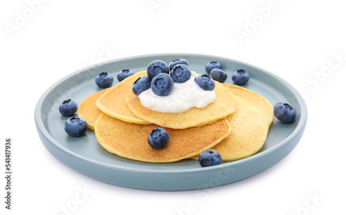 Tasty pancakes with natural yogurt and blueberries on white background