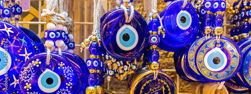 Traditional Turkish amulet Evil Eye or blue eye (Nazar boncugu). Souvenir of Turkey and traditional turkish amulet. Banner. Travel souvenir or gift concept photo