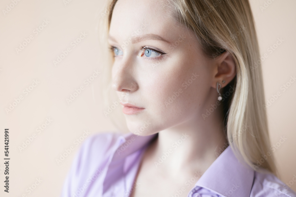 Portrait of a beautiful young woman with blue eyes. Portrait of a beautiful young woman with blue eyes.