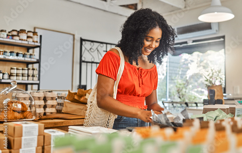 Black woman, shop and grocery for organic, food and happy for shopping, eco friendly or health on sale. Girl, store and retail in supermarket, healthy or product for wellness, healthcare or happiness