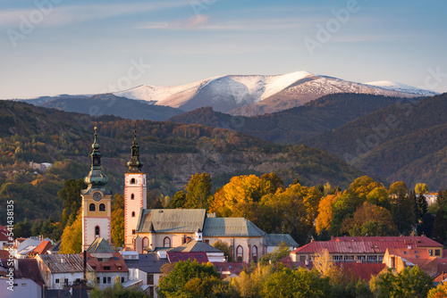 Fall in Banska Bystrica. City landscape with forests and mountains around. Autumn colored and at sunset.