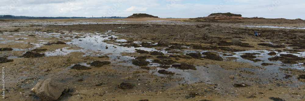 Panorama of landscape during low tide with some puddles on halfway to the island of Callot, Bretagne, France Panorama of landscape during low tide with some puddles on halfway to the island of Callot, Bretagne, France
